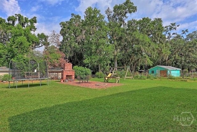 606 Rivers End Dr, Savannah, GA 31406 - view of grassy yard with a trampoline and view of scattered trees