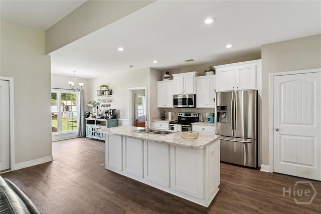 202 Orleans Trl, Statesboro, GA 30461 - kitchen featuring appliances with stainless steel finishes, white cabinets, a kitchen island with sink, dark wood-type flooring, and recessed lighting