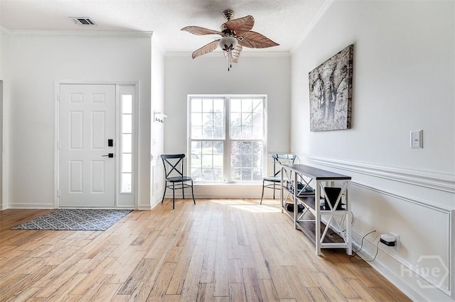 225 Jasper Ln, Rincon, GA 31326 - entryway featuring crown molding, wood finished floors, and a ceiling fan