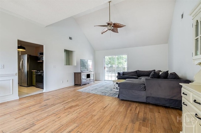 225 Jasper Ln, Rincon, GA 31326 - living room featuring ceiling fan, high vaulted ceiling, and light wood-type flooring