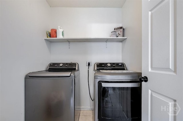 225 Jasper Ln, Rincon, GA 31326 - laundry room featuring washer and clothes dryer and tile patterned floors