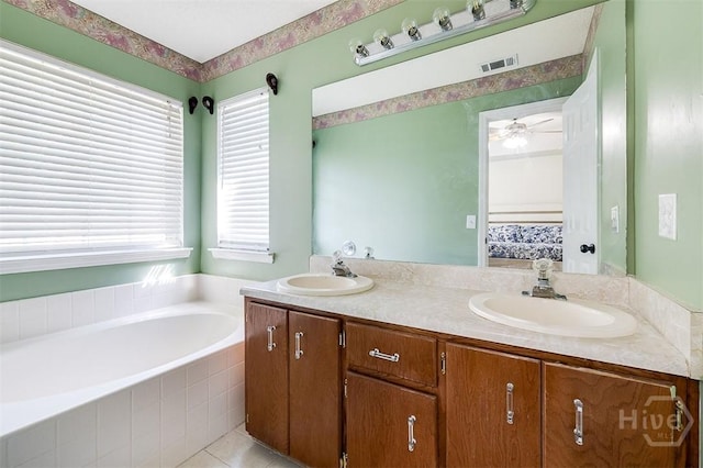 225 Jasper Ln, Rincon, GA 31326 - ensuite bathroom featuring double vanity, a garden tub, plenty of natural light, and ceiling fan