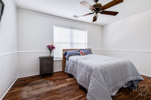 225 Jasper Ln, Rincon, GA 31326 - bedroom featuring wood finished floors, crown molding, a wainscoted wall, and a ceiling fan