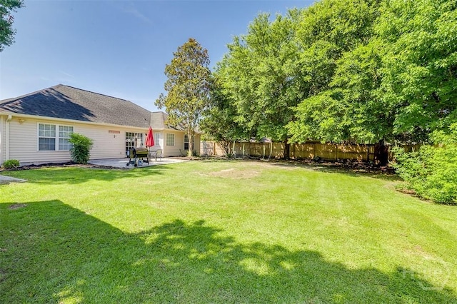225 Jasper Ln, Rincon, GA 31326 - fenced backyard featuring a patio area