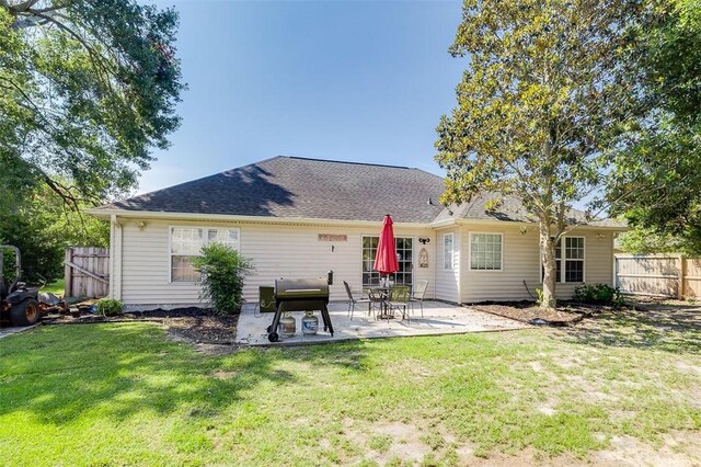225 Jasper Ln, Rincon, GA 31326 - back of property with a patio and roof with shingles