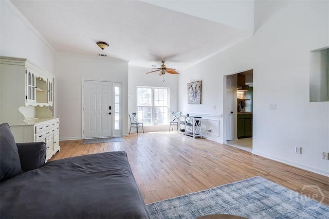 225 Jasper Ln, Rincon, GA 31326 - living room featuring crown molding, light wood-style flooring, and a ceiling fan