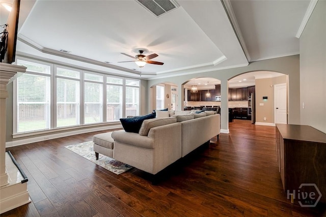 121 Cypress Loop, Bloomingdale, GA 31302 - living area with a tray ceiling, a ceiling fan, healthy amount of natural light, and ornamental molding