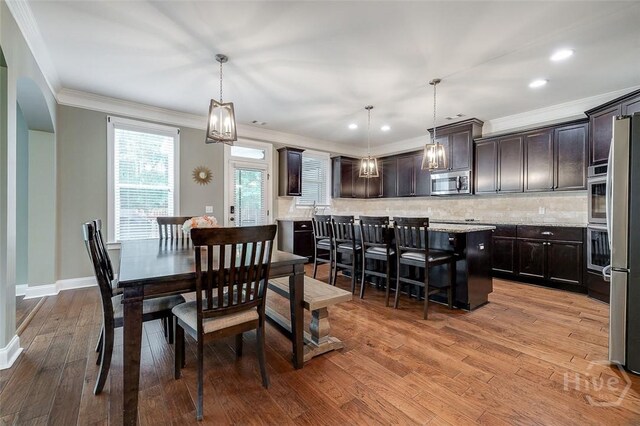 121 Cypress Loop, Bloomingdale, GA 31302 - dining area featuring light wood-style floors, ornamental molding, and recessed lighting