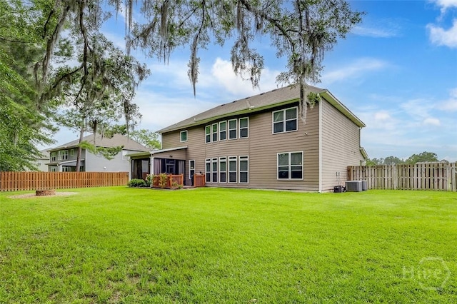 121 Cypress Loop, Bloomingdale, GA 31302 - back of house featuring a fenced backyard and a sunroom