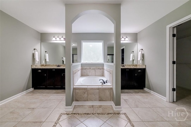 121 Cypress Loop, Bloomingdale, GA 31302 - full bathroom featuring tile patterned floors, a bath, and two vanities