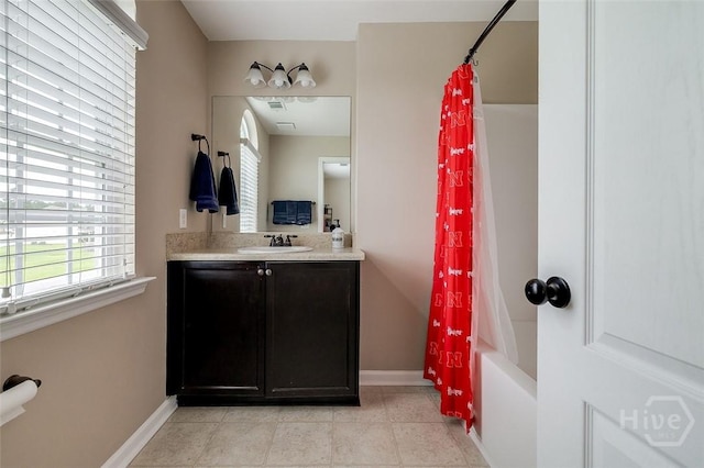 121 Cypress Loop, Bloomingdale, GA 31302 - bathroom featuring vanity, healthy amount of natural light, shower / bath combo with shower curtain, and tile patterned flooring