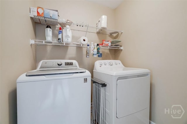 121 Cypress Loop, Bloomingdale, GA 31302 - laundry area featuring washer and clothes dryer