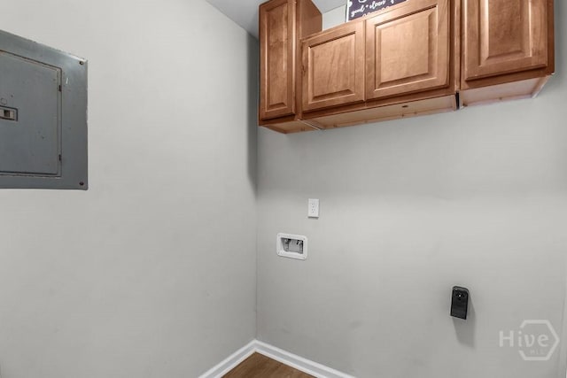 213 Executive Park Dr, Savannah, GA 31406 - laundry area featuring electric panel, cabinet space, washer hookup, and wood finished floors