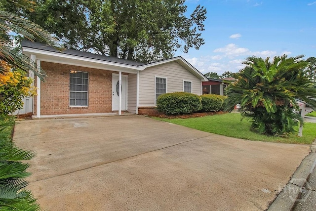 213 Executive Park Dr, Savannah, GA 31406 - single story home featuring brick siding and a front lawn