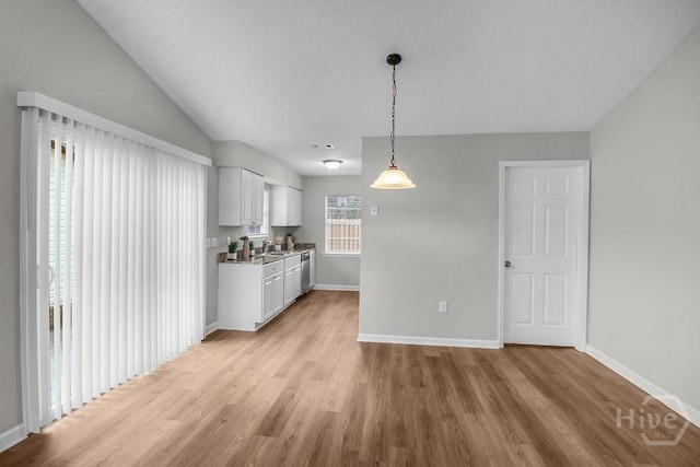 213 Executive Park Dr, Savannah, GA 31406 - kitchen with light wood finished floors, white cabinets, pendant lighting, and stainless steel dishwasher