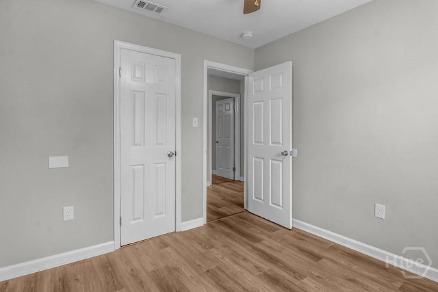 213 Executive Park Dr, Savannah, GA 31406 - unfurnished bedroom featuring light wood finished floors and a ceiling fan