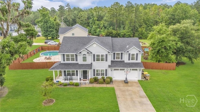 291 Kerry Dr, Richmond Hill, GA 31324 - traditional home featuring driveway, an attached garage, roof with shingles, and a porch