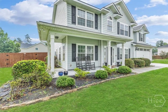 291 Kerry Dr, Richmond Hill, GA 31324 - traditional-style house with covered porch and an attached garage