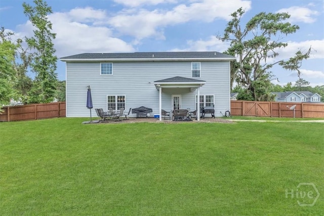 291 Kerry Dr, Richmond Hill, GA 31324 - back of house with a fenced backyard and a patio area