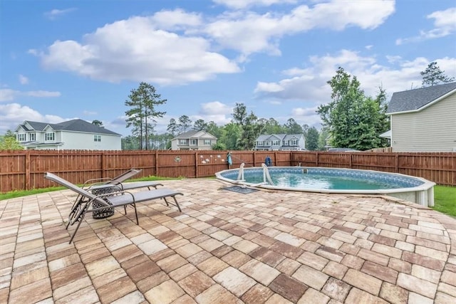 291 Kerry Dr, Richmond Hill, GA 31324 - view of swimming pool featuring a patio and a fenced backyard