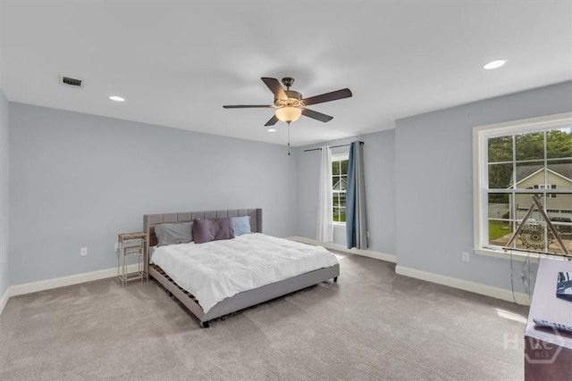 291 Kerry Dr, Richmond Hill, GA 31324 - carpeted bedroom with multiple windows, recessed lighting, and a ceiling fan