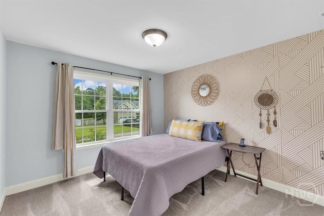 291 Kerry Dr, Richmond Hill, GA 31324 - bedroom with carpet floors, wallpapered walls, and an accent wall