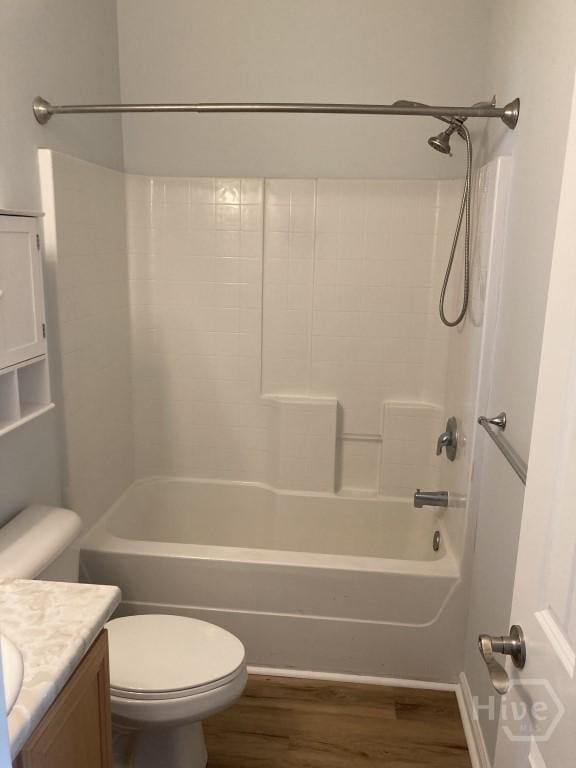 129 Ridgewood Cir, Rincon, GA 31326 - bathroom with vanity, wood finished floors, and washtub / shower combination