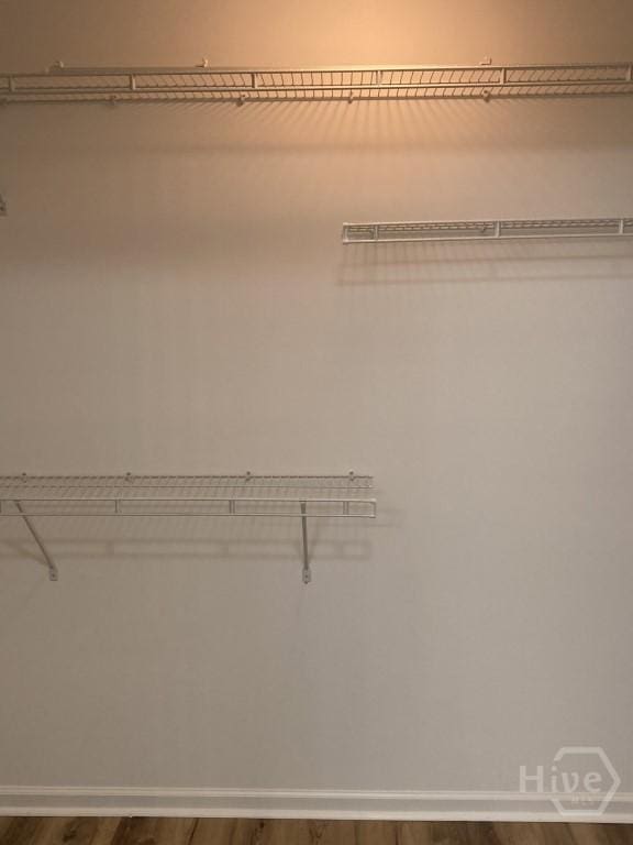 129 Ridgewood Cir, Rincon, GA 31326 - spacious closet featuring dark wood-type flooring