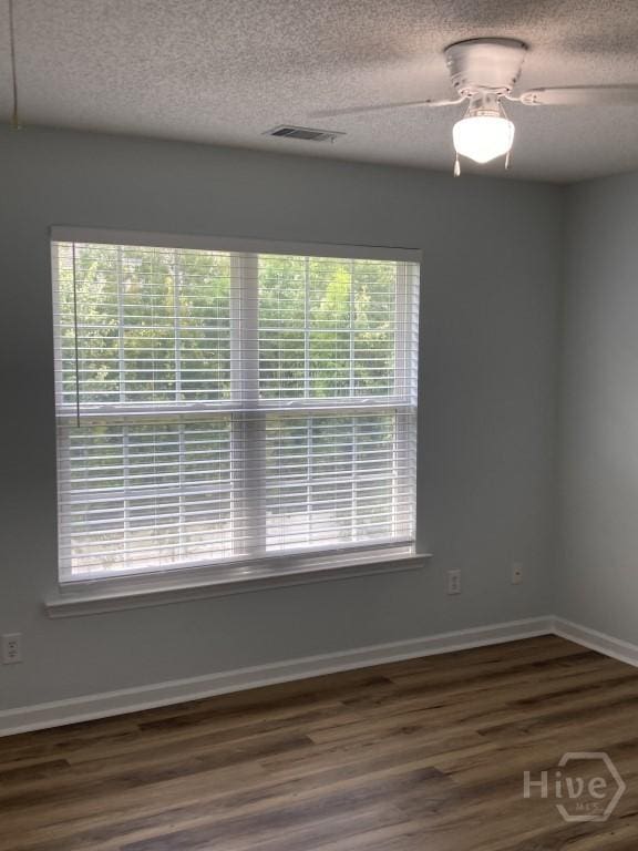 129 Ridgewood Cir, Rincon, GA 31326 - unfurnished room featuring a textured ceiling, wood finished floors, and a ceiling fan