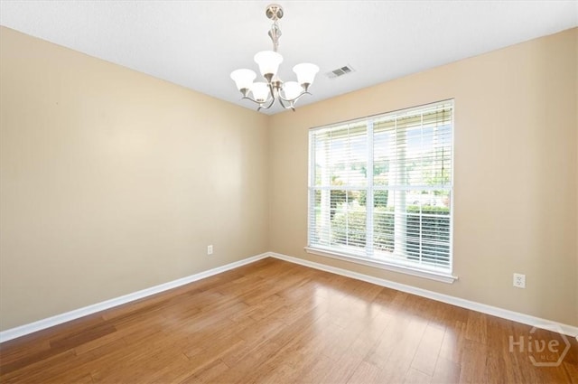 10 Cassidy Ct, Pooler, GA 31322 - empty room with a chandelier and light wood-style flooring
