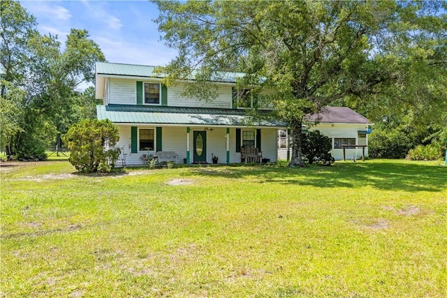 675 Foxwood Cir, Jesup, GA 31545 - view of front of home featuring a porch, a front yard, and a metal roof