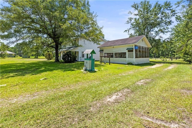 675 Foxwood Cir, Jesup, GA 31545 - view of green lawn with a sunroom