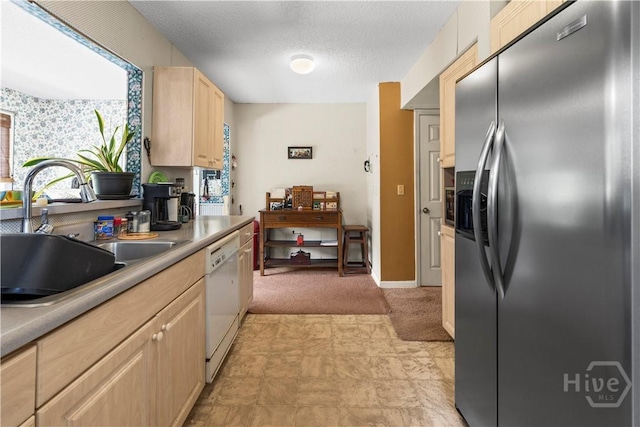 675 Foxwood Cir, Jesup, GA 31545 - kitchen with stainless steel refrigerator with ice dispenser, light brown cabinets, white dishwasher, a textured ceiling, and light colored carpet