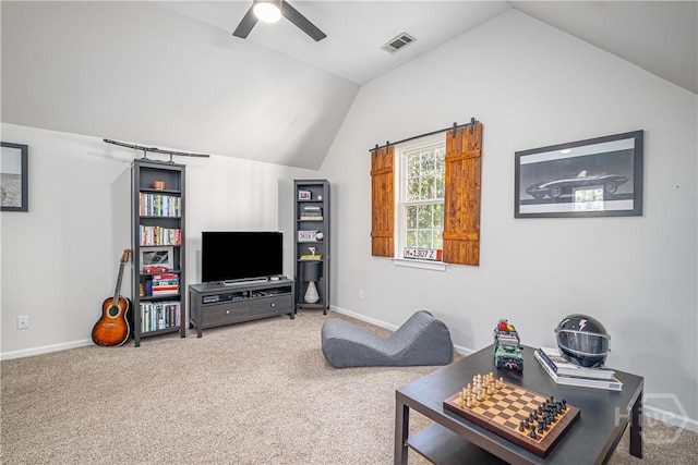 8720 Ferguson Ave, Savannah, GA 31406 - living room with vaulted ceiling, ceiling fan, and carpet flooring