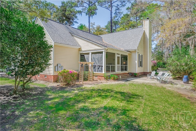 8720 Ferguson Ave, Savannah, GA 31406 - rear view of property with a patio, a sunroom, a shingled roof, and a chimney