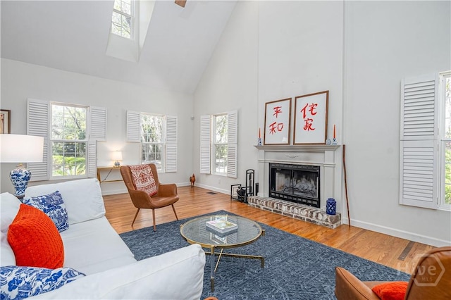 8720 Ferguson Ave, Savannah, GA 31406 - living room with high vaulted ceiling, wood finished floors, and a fireplace