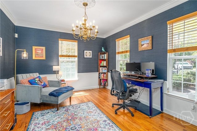 8720 Ferguson Ave, Savannah, GA 31406 - home office featuring plenty of natural light, a chandelier, wood finished floors, wallpapered walls, and ornamental molding
