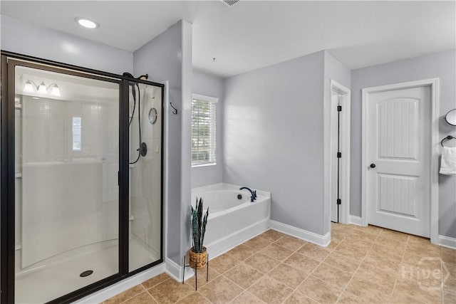 85 Wicklow Dr, Richmond Hill, GA 31324 - full bathroom with a garden tub, a stall shower, and tile patterned flooring