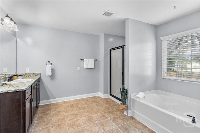 85 Wicklow Dr, Richmond Hill, GA 31324 - full bathroom with vanity, a garden tub, and a shower stall