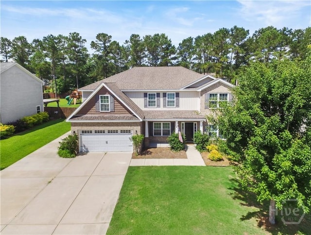 85 Wicklow Dr, Richmond Hill, GA 31324 - craftsman house featuring concrete driveway, a garage, a front yard, and a shingled roof