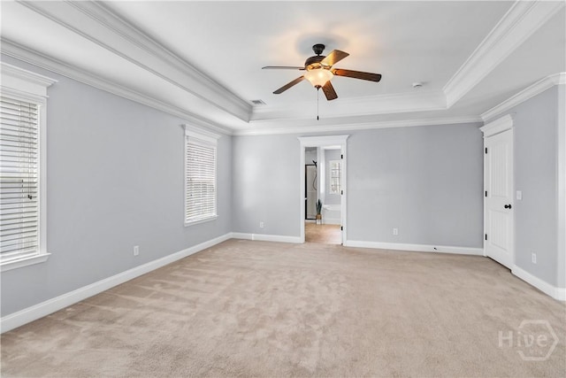85 Wicklow Dr, Richmond Hill, GA 31324 - spare room with a raised ceiling, ceiling fan, crown molding, and light carpet
