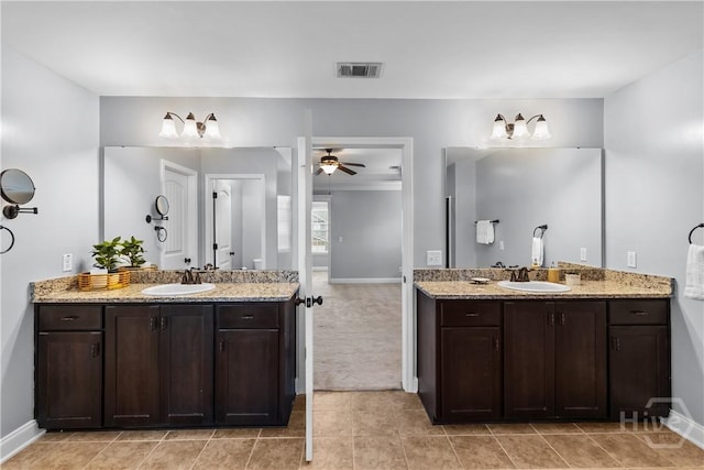 85 Wicklow Dr, Richmond Hill, GA 31324 - full bath featuring two vanities, a ceiling fan, and tile patterned floors