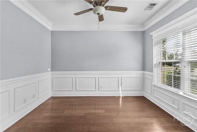 85 Wicklow Dr, Richmond Hill, GA 31324 - unfurnished room with a wainscoted wall, ornamental molding, dark wood finished floors, and a ceiling fan