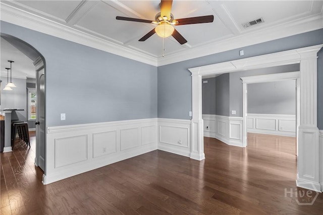 85 Wicklow Dr, Richmond Hill, GA 31324 - spare room featuring ceiling fan, arched walkways, dark wood-style flooring, ornate columns, and ornamental molding