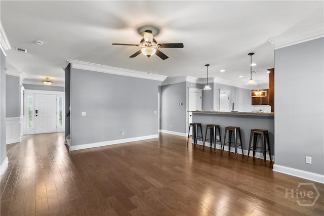 85 Wicklow Dr, Richmond Hill, GA 31324 - unfurnished living room with a ceiling fan, crown molding, dark wood-style flooring, and recessed lighting