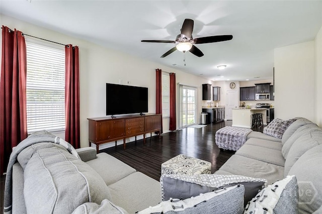 353 Casey Dr, Pooler, GA 31322 - living room featuring a ceiling fan and dark wood-type flooring