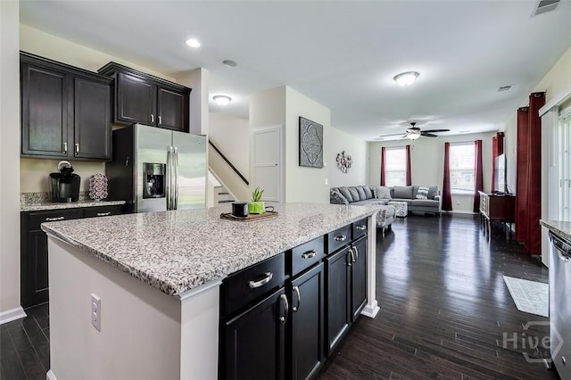 353 Casey Dr, Pooler, GA 31322 - kitchen featuring appliances with stainless steel finishes, dark wood-style floors, ceiling fan, open floor plan, and a kitchen island