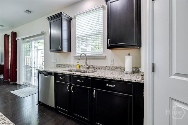 353 Casey Dr, Pooler, GA 31322 - kitchen with stainless steel dishwasher, dark wood-style flooring, dark cabinetry, and light stone counters