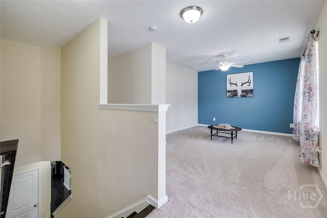 353 Casey Dr, Pooler, GA 31322 - sitting room featuring a ceiling fan, carpet, and an upstairs landing