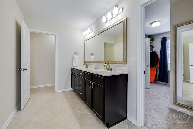 353 Casey Dr, Pooler, GA 31322 - bathroom with double vanity, tile patterned floors, and a walk in closet